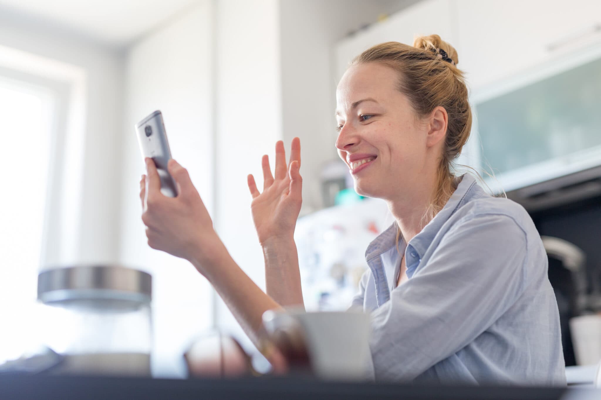 woman video calling using phone