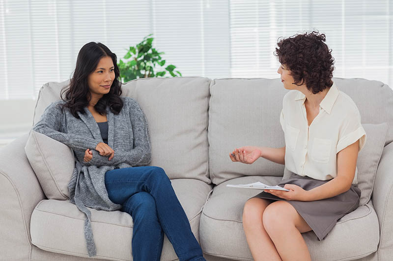 woman speaking with her therapist